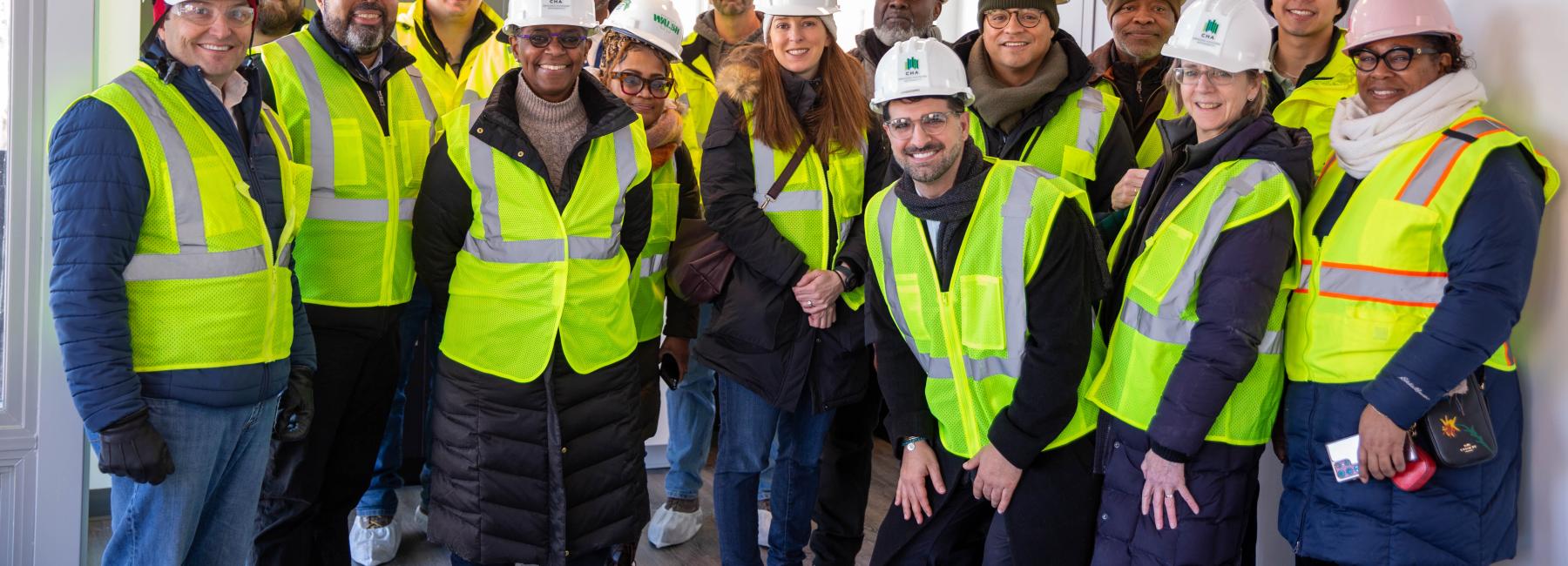 CHA Staff pose in hardhats during a site visit to Park Boulevard 