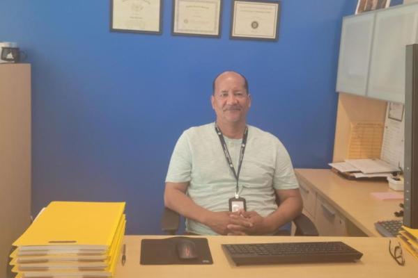 Jose Serrano behind his desk 