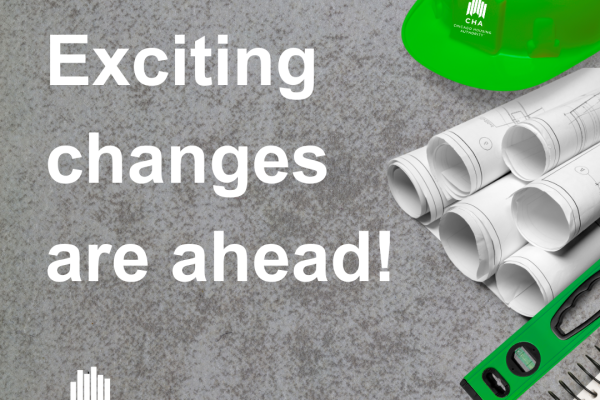 A picture of building materials containing the text "Exciting changes are ahead!"