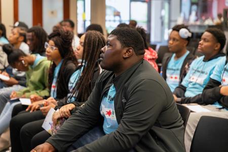 Youth sitting for a presentation.