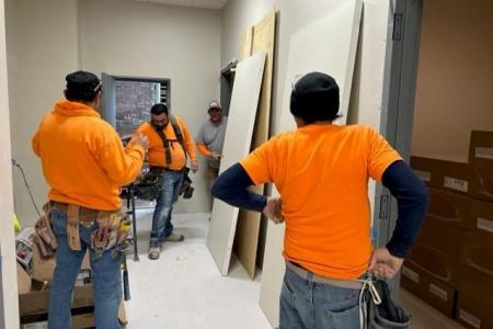 A construction crew working in an Englewood building.