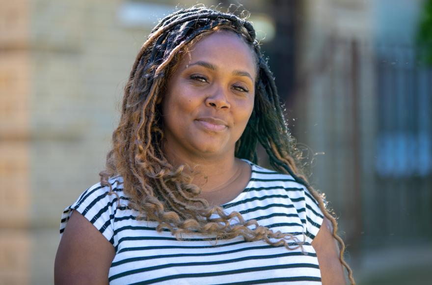 Woman with long hair and a striped shirt.